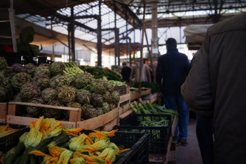 Morning produce stalls at a covered Florentine food market